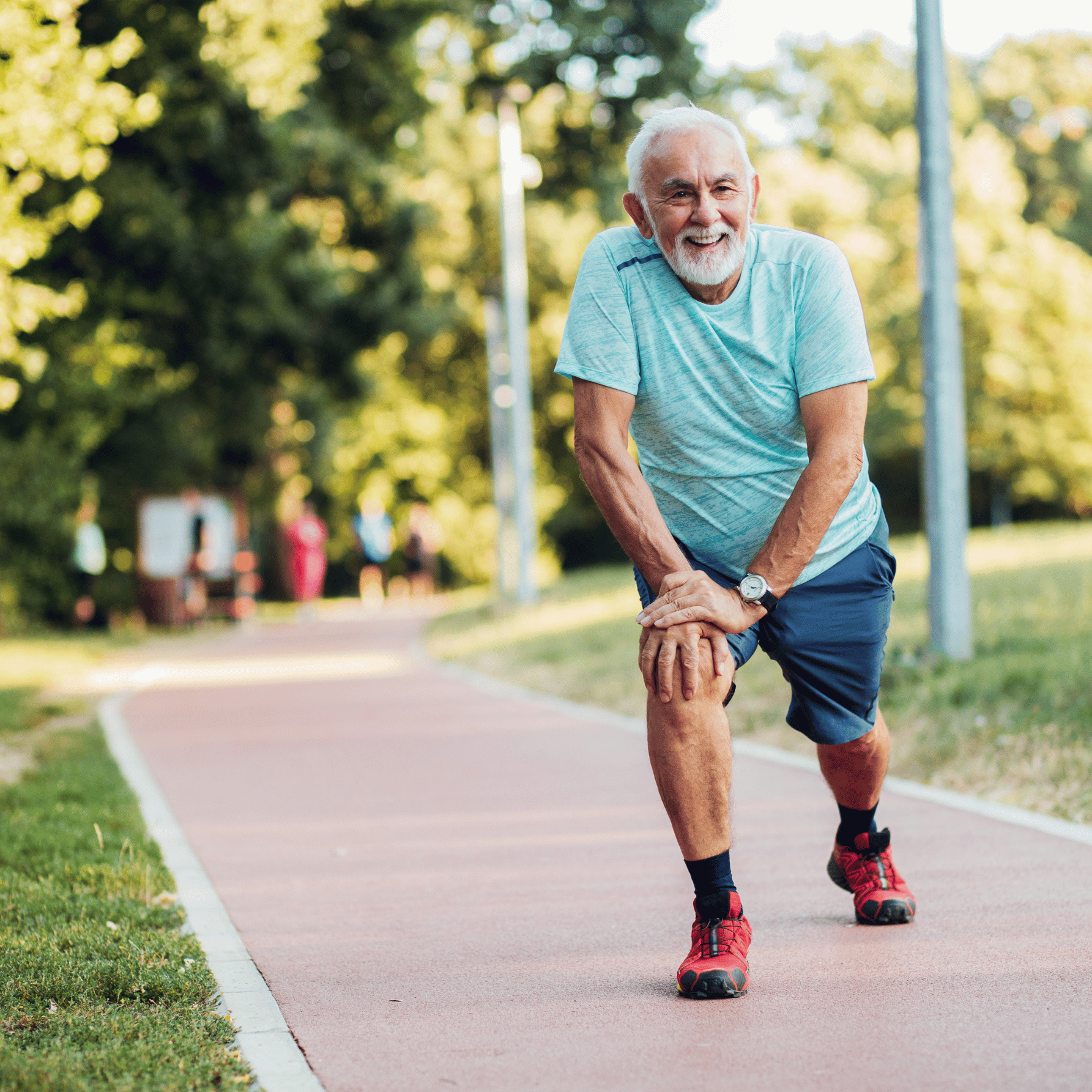 older man preparing to run in the park